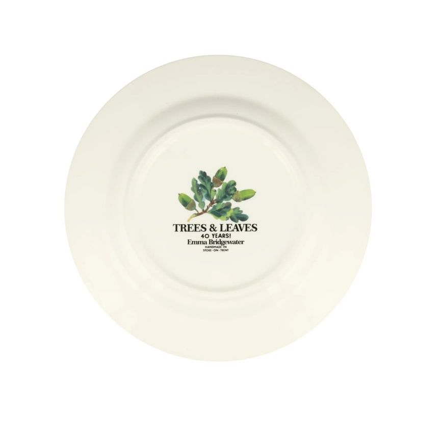 Decorative plate with acorn and leaf design on a white background