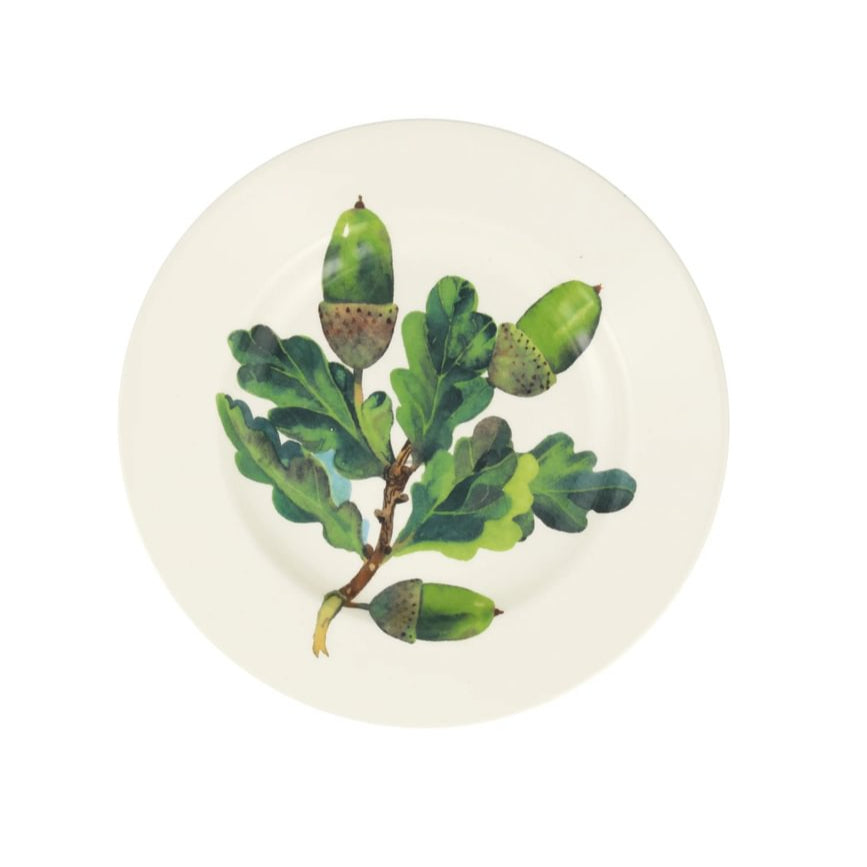 Decorative plate with acorn and leaf design on a white background