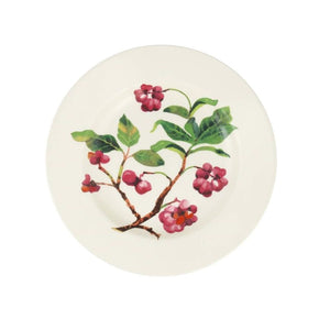 Round ceramic plate with floral design on a white background